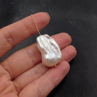 Крупная АAA Grade жемчужина с ядром, размер 28мм; #52